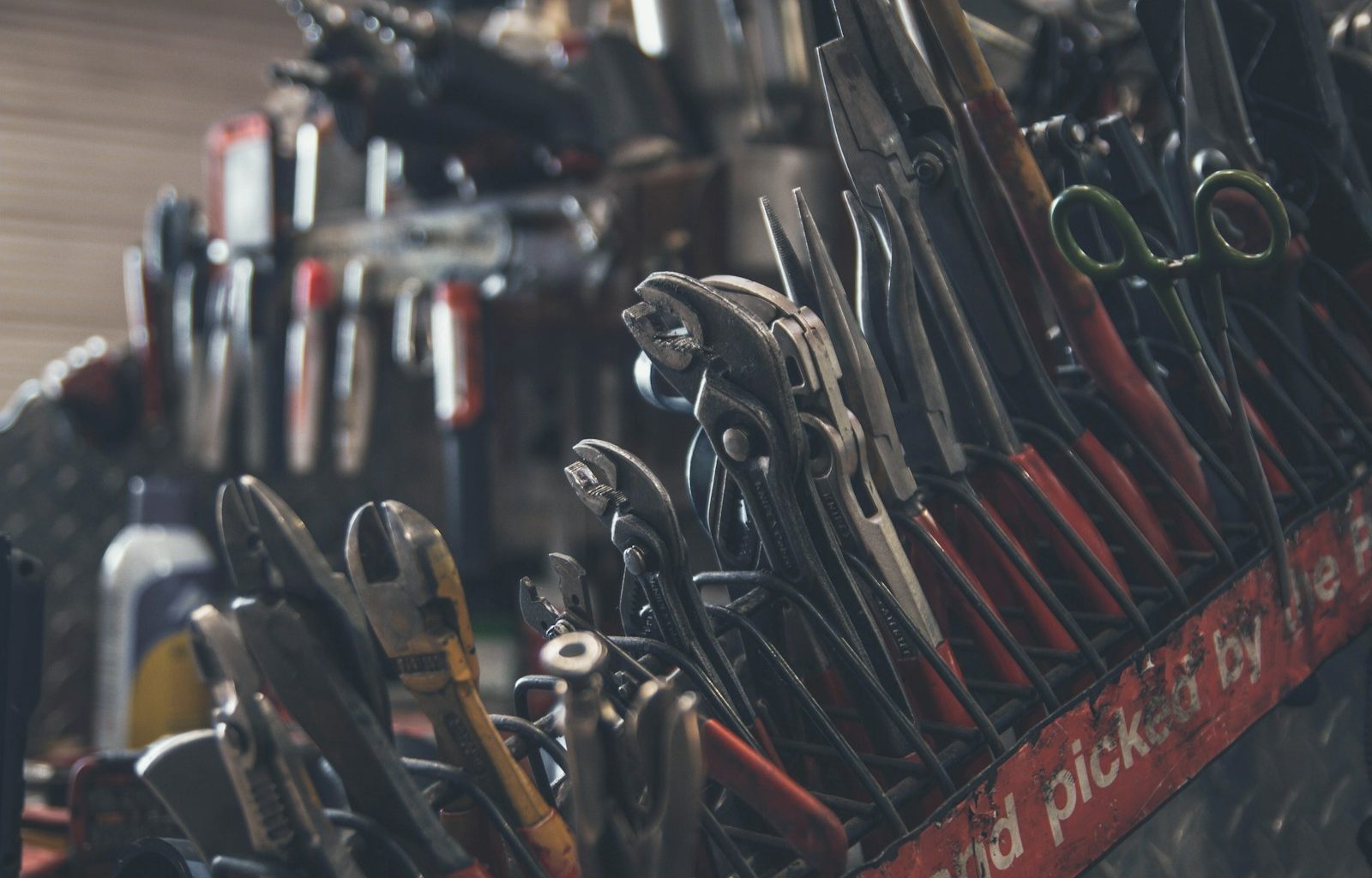 selective focus photography of mechanics tool lot