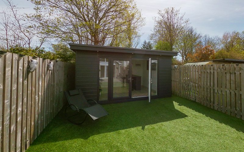 a small shed in a backyard