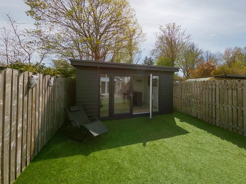 a small shed in a backyard