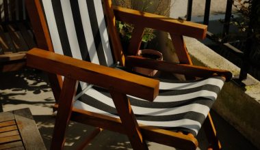 a wooden chair sitting on top of a wooden deck