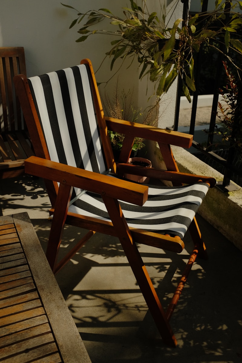 a wooden chair sitting on top of a wooden deck