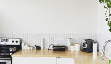 black coffee maker on brown wooden kitchen table