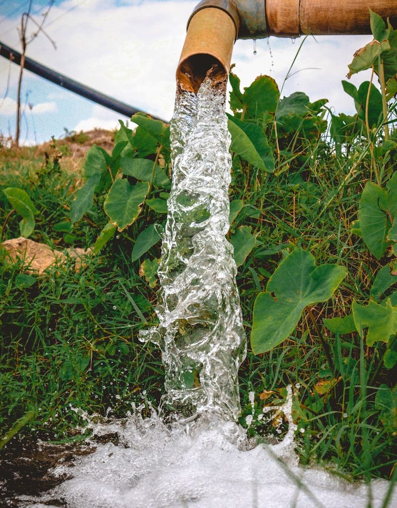 a pipe that has water coming out of it