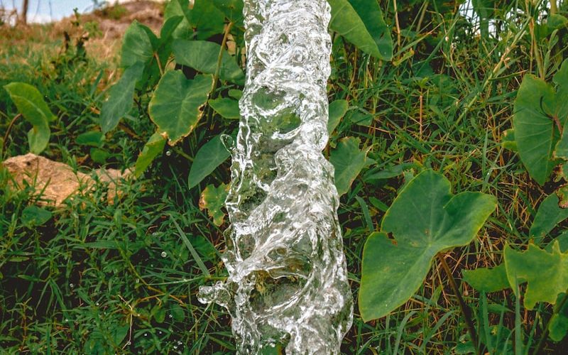 a pipe that has water coming out of it